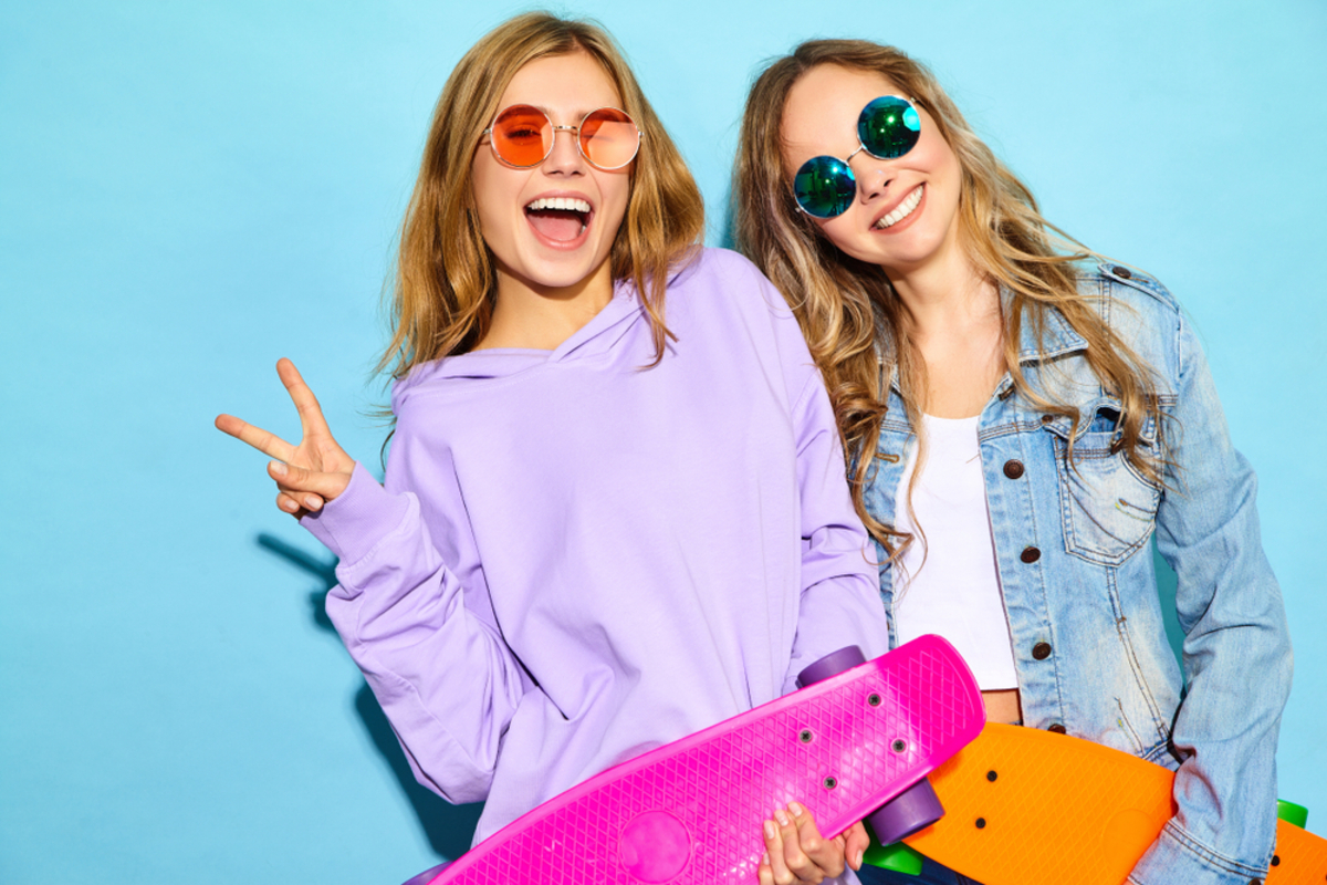 Two,Young,Stylish,Smiling,Blond,Women,With,Penny,Skateboards.,Models